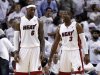 Miami Heat's LeBron James (6) and Dwyane Wade (3) talk during the second half of Game 5 of an NBA basketball Eastern Conference semifinal playoff series against the Indiana Pacers, in Miami on Tuesday, May 22, 2012. The Heat defeated the Pacers 115-83. (AP Photo/Lynne Sladky)