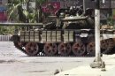This image made from amateur video released by the Shaam News Network and accessed Sunday, July 29, 2012, shows a Syrian military tank in Daraa, Syria. (AP Photo/Shaam News Network via AP video) TV OUT, THE ASSOCIATED PRESS CANNOT INDEPENDENTLY VERIFY THE CONTENT, DATE, LOCATION OR AUTHENTICITY OF THIS MATERIAL