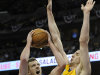 Golden State Warriors forward David Lee, left, drives the lane against Denver Nuggets center Kosta Koufos, right, in the first quarter of Game 1 in the first round of the NBA basketball playoffs on Saturday, April 20, 2013, in Denver. (AP Photo/Chris Schneider)