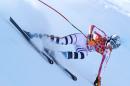 Germany's Maria Hoefl-Riesch makes a turn in a women's downhill training run for the Sochi 2014 Winter Olympics, Friday, Feb. 7, 2014, in Krasnaya Polyana, Russia. (AP Photo/Alessandro Trovati)