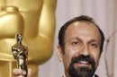 FILE - In this Sunday, Feb. 26, 2012 file photo, Asghar Farhadi, of Iran, poses with the Oscar for best foreign language film for 