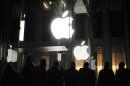 People gather outside an Apple retail store on Fifth Avenue in the Manhattan borough of New York, Friday, March 16, 2012, as they wait for the 8 a.m. local time release of the new iPad tablet. (AP Photo/Jeffrey Furticella)