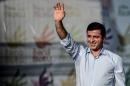 Selahattin Demirtas, co-leader of Turkey's pro-Kurdish People's Democratic Party, waves during a peace gathering in Istanbul on August 9, 2015