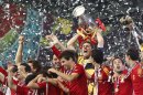Spain goalkeeper Iker Casillas lifts the trophy after the Euro 2012 soccer championship final between Spain and Italy in Kiev, Ukraine, Sunday, July 1, 2012. Spain won the match 4-0. (AP Photo/Gregorio Borgia)