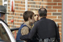 T.J. Lane, a suspect in Monday's shooting of five students at Chardon High School is taken into juvenile court by Geauga County deputies in Chardon, Ohio Tuesday, Feb. 28, 2012. Three of the five students wounded in the attacks have since died. (AP Photo/Mark Duncan)