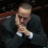 Italian Premier Silvio Berlusconi reacts prior to the start of a voting session in Parliament  on the Government's austerity package in Rome, Wednesday, Sept. 14, 2011.  Demonstrators, some armed with smoke bombs, clashed with police in Rome near Parliament on Wednesday night as Italian lawmakers prepared to cast a final vote on a package of new taxes and spending cuts designed to fend off a financial crisis threatening much of Europe. (AP Photo/Gregorio Borgia)