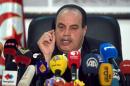 Tunisian Interior Minister Mohamed Najem Gharsalli speaks with journalists during a press conference on March 26, 2015 in Tunis