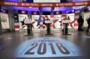 Workers stand at the podiums on stage during final preparations for Saturday night's Democratic presidential debate between Sen. Bernie Sanders, I-Vt, Hillary Rodham Clinton and former Maryland Gov. Martin O'Malley, Friday, Nov. 13, 2015, in Des Moines, Iowa. (AP Photo/Charlie Neibergall)