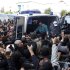 The body of Shokri Belaid, a prominent Tunisian opposition politician, is carried into an ambulance after he was shot, in Tunis