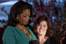 In this photo taken Friday March 9, 2012, Oprah Winfrey presents Jaycee Dugard with a DVF Award at The Third Annual DVF Awards held at the United Nations in New York. Dugard, who survived being kidnapped and held captive for 18 years, recently left her undisclosed California home to travel to New York City to make her first public appearance at an awards ceremony with Winfrey and give an interview with ABC News. She told ABC News that she plans to live in hiding until her two daughters, who were conceived in rapes by Dugardâ€™s kidnapper, are older and can better understand the circumstances in which they were born. (AP Photo/Charles Sykes)