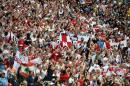 England supporters cheer ahead of the Group D football match between Uruguay and England at the Corinthians Arena in Sao Paulo on June 19, 2014, during the 2014 FIFA World Cup