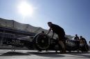 The Force India Formula One team pushes a car down pit lane for the Formula One U.S. Grand Prix auto race at the Circuit of the Americas, Thursday, Oct. 30, 2014, in Austin, Texas. (AP Photo/Darron Cummings)