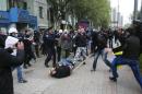 Pro-Russian men attack pro-Ukrainian supporters during a pro-Ukrainian rally in Donetsk