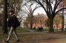 A student walks through Harvard Yard at Harvard University in Cambridge