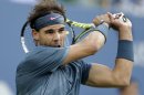 Rafael Nadal, of Spain, returns a shot to Novak Djokovic, of Serbia, during the men's singles final of the 2013 U.S. Open tennis tournament, Monday, Sept. 9, 2013, in New York. (AP Photo/Darron Cummings)