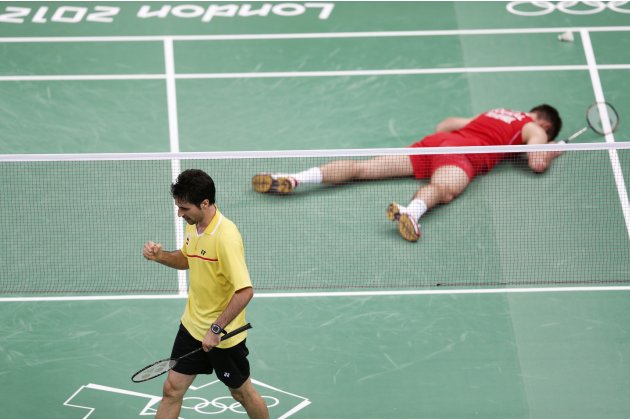 Spain's Pablo Abian celebrates a point against The Czech Republic's Petr Koukal during their men's singles group play stage badminton match at the Wembley Arena during the London 2012 Olympic Games