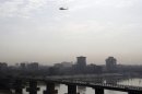 An Iraqi army helicopter patrols the skies above Baghdad's Green Zone