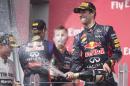 Winner of the Canadian Formula One Grand Prix Red Bull driver Daniel Ricciardo (R) of Australia sprays champagne in celebration at the Circuit Gilles Villeneuve in Montreal on June 8, 2014