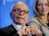 Chairman and CEO of News Corporation Murdoch talks next to Jobs as they take part in a panel discussion titled "Immigration Strategy for the Borderless Economy" at the Milken Institute Global Conference in Beverly Hills, California
