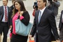Former presidential candidate and U.S. Sen. John Edwards, right, leaves a federal court with his daughter Cate, left, in Greensboro, N.C., Monday, April 23, 2012. A former aide to Edwards has taken the witness stand in his criminal trial to testify about his role in allegedly violating campaign finance laws to cover up an extramarital affair. (AP Photo/Chuck Burton)