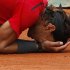 Nadal of Spain reacts after winning the men's singles final match against Djokovic of Serbia at the French Open tennis tournament at the Roland Garros stadium in Paris