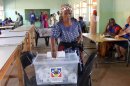 An elderly lady casts her vote at a polling station in Nhlangano, Swaziland on September 20, 2013