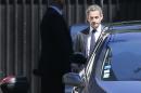 Former French President Nicolas Sarkozy leaves his residence in Paris