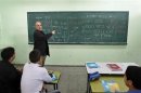 Palestinian teacher teaches Hebrew to ninth grade students at a Gaza school in Gaza City