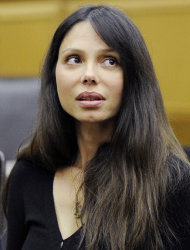 Russian musician Oksana Grigorieva appears in a Los Angeles courtroom in a long-running custody dispute with actor Mel Gibson over their young daughter Wednesday, Aug. 31, 2011, in Los Angeles. Gibson will pay $750,000 to his ex-girlfriend and continue to provide housing and financial support for their young daughter to resolve a legal fight between the former lovers, a judge announced Wednesday. (AP Photo/Kevork Djansezian, Pool)