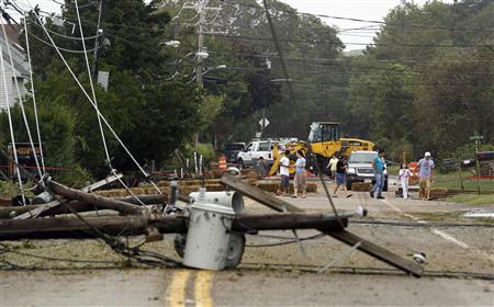 Residents inspect fallen power lines in Hampton Bays, New York