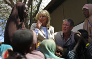 In this photograph taken during an official White House organized visit, Jill Biden, wife of U.S. Vice President Joe Biden, center, sits with Somali refugees during a photo opportunity at a UNHCR screening center on the outskirts of Ifo camp outside Dadaab, eastern Kenya, 100 kms (60 miles) from the Somali border, Monday Aug. 8, 2011. Jill Biden on Monday is visiting the world's largest refugee camp, Dadaab, where tens of thousands of Somali famine refugees have arrived in recent weeks. The U.S. says that more than 29,000 Somali children under the age of 5 have died from the famine in the last three months. (AP Photo/Jerome Delay)