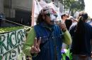 A man smokes marijuana during a rally in front of the Supreme Court of Justice in Mexico City on November 4, 2015