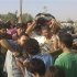 Residents carry the bodies of Abu Al-Laith and Abu Hafeth, whom activists say were killed by forces loyal to Syria's President Bashar al-Assad, during their funeral at Binsh