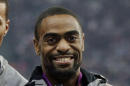 FILE - In this Aug. 11, 2012, file photo, Tyson Gay celebrates after receiving the silver medal for the men's 4x100-meter race during the athletics competition in the Olympic Stadium at the 2012 Summer Olympics, London. Gay has accepted a one-year suspension and has returned the silver medal he won at the London Olympics after he tested positive for a prohibited substance, USADA announced Friday, May 2, 2014. (AP Photo/Matt Slocum, File)