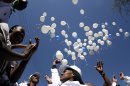 Members of the Tshwane gospel choir release 95 white balloons to mark the upcoming 95th birthday on July 18 of ailing former South African President Nelson Mandela as they sing in Pretoria