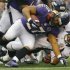 Baltimore Ravens running back Rice is tackled by Denver Broncos linebacker Brooking during their NFL football game in Baltimore
