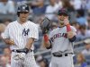 New York Yankees' Mark Teixeira, left, chats with Cleveland Indians first baseman Nick Swisher during a baseball game at Yankee Stadium in New York, Monday, June 3, 2013. It was the first time Swisher was back at Yankee Stadiium since he played for the Yankees. (AP Photo/Kathy Willens)
