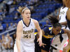 Notre Dame's Natalie Novosel, left, drives past West Virginia's Linda Stepney during the first half of Notre Dame's 73-45 victory in an NCAA college basketball game in the semifinals of the Big East women's tournament in Hartford, Conn., Monday, March 5, 2012. (AP Photo/Fred Beckham)