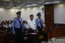 Disgraced Chinese politician Bo Xilai stands trial inside the court in Jinan, Shandong province