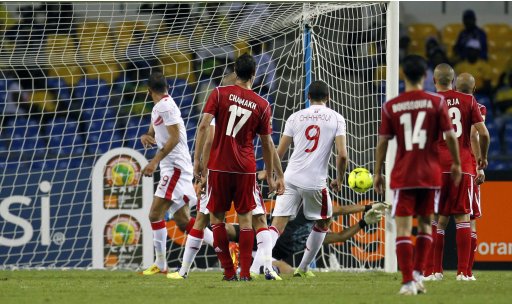 Tunisia's Saber scores against Morocco during their African Cup of Nations soccer match in Libreville