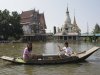 Thai women paddle on a boat through a flooded street at Ban Kadee temple in Phatum Thani province, north of Bangkok ,Thailand, Wednesday, Oct. 19, 2011. Thai authorities were staging a fighting retreat Wednesday against flood waters that threaten Bangkok, after the country's oldest factory park was completely inundated and a nearby one faced imminent threat. (AP Photo/Sakchai Lalit)