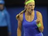 Victoria Azarenka of Belarus reacts after winning a point against Russia's Maria Sharapova during the women's singles final at the Australian Open tennis championship in Melbourne, Australia, Saturday, Jan. 28, 2012. (AP Photo/Andrew Brownbill)