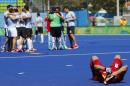 Spain's Miguel Delas lies on the pitch after his team lost to Argentina during a men's field hockey quarter final match at the 2016 Summer Olympics in Rio de Janeiro, Brazil, Sunday, Aug. 14, 2016. (AP Photo/Dario Lopez-Mills)