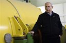 Israel's Prime Minister Netanyahu stands next to an FEL during a visit to the Ariel University Centre in the Jewish settlement of Ariel