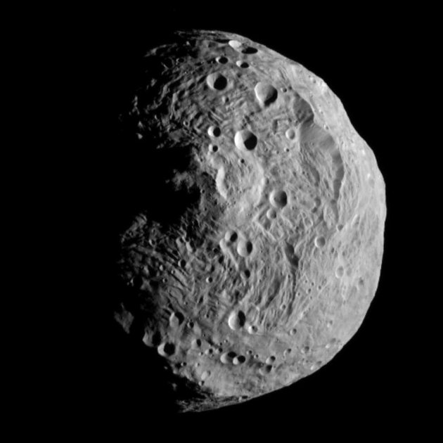FILE - This file image released by the Jet Propulsion Laboratory on Monday, July 18, 2011 shows the asteroid Vesta, photographed by the Dawn spacecraft on July 17, 2011. The image was taken from a dis