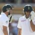 South Africa's de Villiers and du Plessis adjust their helmets while batting together at the Adelaide cricket ground during the fourth day's play of the second cricket test match in Adelaide
