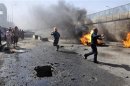 A policeman reacts at the scene of a car bomb attack in Nasiriyah
