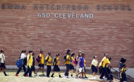FILE - In a July 13, 2011 file photo, students at Emma Hutchinson School in Atlanta leave after the day's classes. Hutchinson has been identified as one of forty four schools involved in a test cheating scandal. A new state report reveals how far some Atlanta public schools went to raise test scores in the nation’s largest-ever cheating scandal. The scandal first came to light two years ago. Now, investigators have concluded that nearly half the city’s schools allowed cheating to go unchecked for as long as a decade, beginning in 2001. (AP Photo/John Bazemore, File)