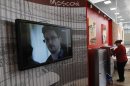 A television screens the image of former U.S. spy agency contractor Edward Snowden during a news bulletin at a cafe at Moscow's Sheremetyevo airport
