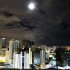 Moon rises above buildings in Salvador, Brazil